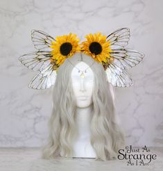 A real must-have statement crown for all fairies!  A beautiful sunflower yellow Harvest/Autumn flower fairy headdress. The large wings are made of acetate and glaze, and are very lightweight. They are backed with wire, which is what gives them their gorgeous curve. They are flexible to touch, and may be very slightly adjusted to give a deeper/more shallow curve. The headdress is decorated with sunflowers and multi yellow/ochre blossoms. Sparkling Swarovski beads hang over the forehead from a sil Elf Crown Bee, Sunflower Bridal Crown, Ren Faire Headdress, Cheap Whimsical Halloween Costume Hats And Headpieces, Gold Feather Fairy Costume, Fae Costume Fairy Queen, Fairy Yellow Dresses, Bee Women Costume, Elf Crown Yellow