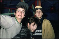 four young men posing for a photo together