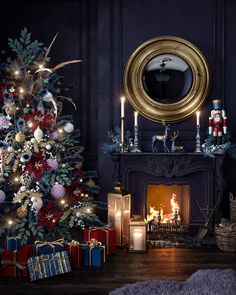 a decorated christmas tree in front of a fireplace