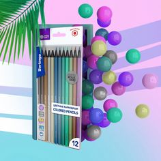 there are many different colored pencils in the box and one has a palm tree