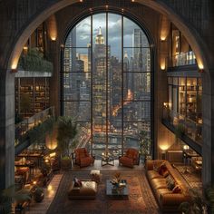 a living room filled with lots of furniture and large windows overlooking the city at night