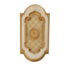 an ornate gold and white wall hanging