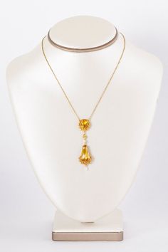 Got YELLOW?  We do in this outstanding brighter than bright 18 k yellow and rose gold Victorian citrine and seed pearl dangle pendant necklace.  Each citrine stone is cradled within a floral wreath design.  So elegant and lively at the same time!  Would you wear this on your wedding day?  We think it would be the perfect antique bridal adornment but we also think it could be your new signature piece!  Antique Necklace - Antique Victorian 1890-1900 18k Two-Tone Citrine & Seed Pearl NecklaceCi Yellow Gold Briolette Gemstone Drop Necklace, Art Nouveau Yellow Gold Jewelry With 17 Jewels, Victorian Yellow Gold Dangle Jewelry, Formal Yellow Gold Drop Necklace With Gemstone, Gold Art Nouveau Necklace With Gemstone, Art Nouveau Gold Necklace With Gemstone, Wedding Yellow Gold Briolette Drop Necklace, Victorian Yellow Gold Necklace With Pearl Pendant, Victorian Gold Faceted Jewelry