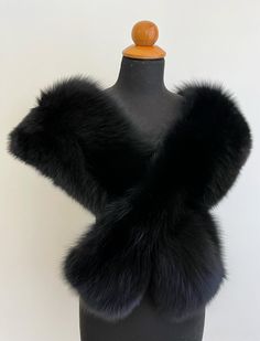 All our garments are brand new, handmade, unused and high quality craftsmanship from genuine material. They have been processed through a professional cleaning. Nothing is reused or recycled. Details: * Real fox fur stole bolero * Handmade * Back side satin lining  * Black color * Made of whole fox pelts * High quality craftsmanship * Eye hook closure * Dimensions: Lenght: 160cm - 62,9inch                          Width: 20cm - 7,9inch * Made in Greece. The real color of the item may be slightly Black Fur Shawl, Luxury Black Fur Coat With Feather Trim, Black Fluffy Faux Fur Outerwear, Black Luxury Faux Fur Outerwear, Eye Hook, Fur Wrap, Bib Collar, Fur Stole, Black Luxury