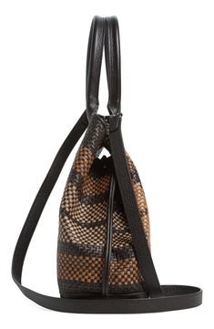 Woven plaid refreshes the look of this signature tote that quickly converts to offer a chic assortment of varying silhouettes. Carry as a classic shopper or cinch it using the inventive turnlock tabs to create a streamlined trapezoidal silhouette, a hallmark of the Akris fashion house. A long strap offers additional versatility, allowing you to seamlessly switch from handheld to crossbody styling. Open top Top carry handles; removable, adjustable crossbody strap Turn-in turnlock tabs Interior po Fall Brown Coated Canvas Shoulder Bag, Chic Cognac Bag With Woven Leather, Chic Handwoven Top Handle Bag, Leather Square Bag With Braided Handles, Designer Brown Bag With Woven Leather, Designer Brown Bags In Woven Leather, Chic Brown Leather Woven Bag, Designer Brown Woven Leather Shoulder Bag, Chic Cognac Woven Leather Bag