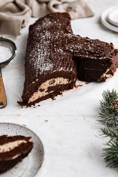 This version of the classic Christmas cake features a chocolate sponge cake that has an espresso-mascarpone filling and is topped with chocolate ganache icing. A dusting of powdered sugar makes it look snow-covered, and you can add some meringue mushrooms and sugared cranberries for a truly spectacular Christmas dessert! Ice Cream Cake Roll, Chocolate Ganache Icing, Chocolate Roulade, Yule Log Recipe, Ganache Icing, Mocha Chocolate, Gingerbread Cake, Yule Log