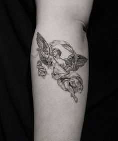 a tattoo on the leg of a woman with an angel above her head and flowers