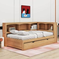 a bed with drawers underneath it in a room