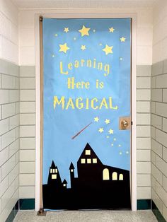 a classroom door decorated with the words learning here is magic