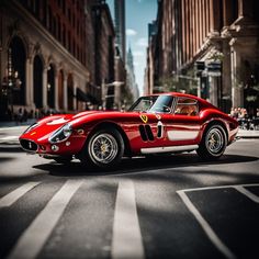 a red sports car is driving down the street