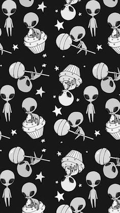 an alien themed wallpaper with stars and other things on it's black background