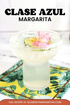 a close up of a margarita in a glass on a table with text overlay