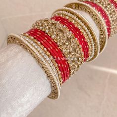 A Pair of 2 medium sized stacks of luxurious antique Gold bangles with pretty strawberry red shades, finished with intricate detailed Champagne Crystal bangles and pearl details. This will make the perfect stack for any Bride or those wanting to make a statement. Pair this with our Rubal Choker Set. Sold as a set for both arms only. Ready to Ship! Antique Gold Bangles, Cristal Champagne, Bridal Survival Kit, Hand Harness, Bangle Box, Red Shades, Bridal Choker, Kundan Set, Bridal Necklace Set