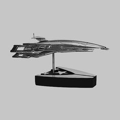 a black and white photo of a model star trek ship