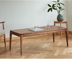 two wooden tables sitting on top of a hard wood floor