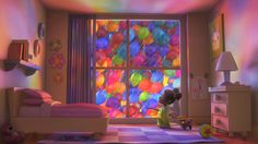 a child is playing in front of a colorful window