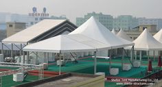 several tents are set up on the roof of a building