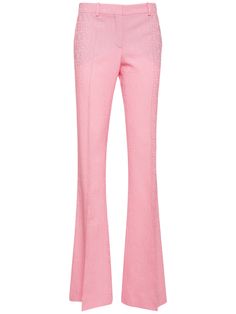 Concealed front hook and zip closure. Belt loops. Two side pockets. Two back pockets. Model is wearing a size38 Pink Wide Leg Trousers, Versace Pants, Velvet Flare Pants, Velvet Flares, Versace Logo, Couture Runway, Flare Trousers, Flared Pants, Wool Pants