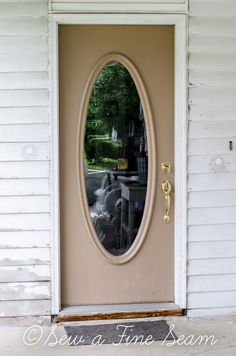 a door with a mirror on it in front of a house