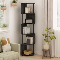 a living room with a couch, chair and bookshelf in front of a window