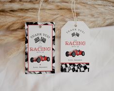 two tags that say thank you for racing with us and have race cars on them