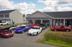 a group of cars parked in front of a house