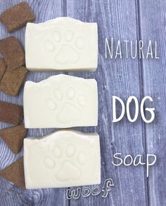 three soap bars with dog paw prints on them and the words, natural dog soap