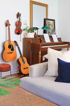 a living room filled with furniture and musical instruments