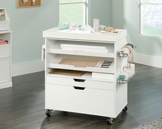 a white cart with drawers in a room