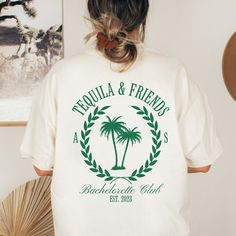 the back of a woman's t - shirt that says tequila and friends, with palm trees