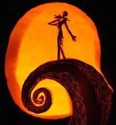 a pumpkin carved to look like a person standing on top of a wave in front of a full moon