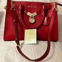 Beautiful Red Bag Bright Shiny Gold Hardware Purchased Brand New At Macy’s Tags On Real Leather Perfect Condition Only Used One Or Two Times Always Kept In Dust Bag Zipper Closure Shoulder Strap With Beautiful Gold Chains On Each End Can Be Used For Shoulder Or Cross. Body This One Is Called The Noubeau Hamilton#30f9g0hs3l Bright Red Large Satchel Real Leather Tags On Purchased At Macy’s For $358. This Bag Is Absolutely Gorgeous But A Bit Too Large For Me. I Am A Very Small Person Did Not Come W Designer Red Bag With Branded Hardware, Designer Red Bags With Branded Hardware, Red Rectangular Satchel With Branded Hardware, Red Satchel With Top Handle And Branded Hardware, Classic Red Bag With Branded Hardware, Red Leather Satchel With Branded Hardware, Michael Kors Red Bag For Everyday Use, Designer Red Satchel With Gold-tone Hardware, Red Leather Bag With Branded Hardware