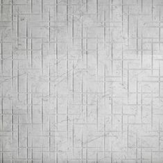 an image of a white tile wall with squares and lines in the pattern on it