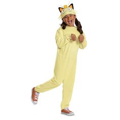 a girl in a yellow cat costume is running with her hands on her hips and smiling