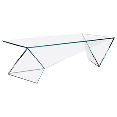 a glass table that is on top of a white surface and has an upside down design