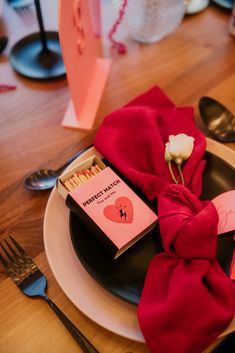 a plate with a red napkin on top of it