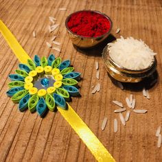 two bowls filled with rice next to each other on top of a wooden table,