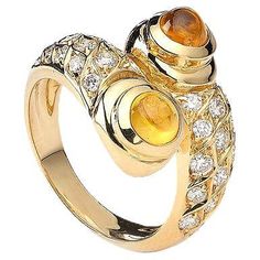 Ring in 18kt yellow gold set with 2 yellow cabochon cut sapphires 1.71 cts and 30 diamonds 0.68 cts Size 50 Diamond Gold Ring, Yellow Gold Diamond Ring, Contemporary Ring, Gold Diamond Ring, Yellow Gold Setting, Square Diamond, Diamonds And Gold, Oval Cut Diamond, Diamond Gold