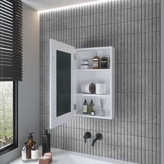 a white sink sitting under a mirror next to a wall mounted medicine cabinet in a bathroom