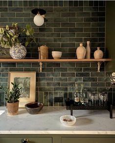 the kitchen counter is clean and ready to be used as a place for drinks or desserts