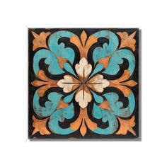 an old wooden tile with blue and orange designs