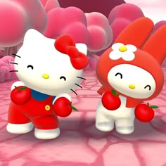 two hello kitty dolls standing next to each other