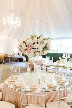 an elegant wedding reception with pink and white flowers