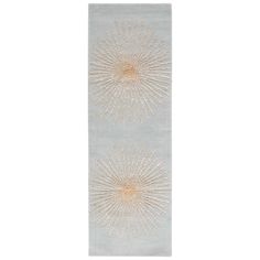 a rug with two sunbursts on the top and one is light blue