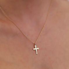 The dainty Cross Necklace, skillfully crafted in 14K Gold, is a refined and stylish accessory that brings an element of elegance to any outfit. It boasts a delicate cross pendant gracefully hanging from a fine gold chain, making it suitable for both everyday wear and special occasions. The use of 14k gold ensures not only durability but also a enduring radiance. Here are the essential details: Artisanally made from 14k solid gold All materials are responsibly sourced from the United States Size Elegant Clavicle Chain Jewelry With Cross Pendant, Elegant Clavicle Chain With Cross Pendant Jewelry, Elegant Clavicle Chain With Cross Pendant, Elegant Necklace With Clavicle Chain And Cross Pendant, Elegant Necklace With Diamond Accents And Cross Pendant, Elegant Cross Pendant Necklace With Diamond Accents, Elegant 14k Gold Hallmarked Necklace, Elegant Cross Pendant Necklace As Gift, Dainty 14k Gold Necklaces For Formal Occasions