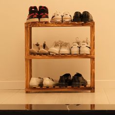 there are many pairs of shoes on the shelf