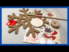 a snowflake cut out from cardboard and some crafting supplies