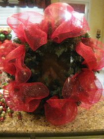 a christmas wreath sitting on top of a kitchen counter