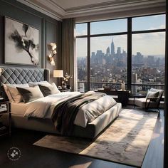 a bedroom with a large window and a view of the city from it's floor to ceiling windows