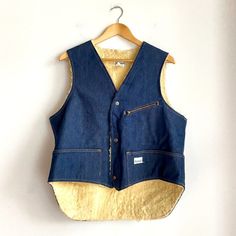 "This vintage Madewell vest features a dark denim exterior and cozy sherpa lining. The XL size fits comfortably and the vest has a classic grunge look that pairs well with a variety of outfits.  Made in the United States during the 1970s, this vest is an original piece and perfect for vintage clothing enthusiasts. The blue color and durable denim material make it a versatile addition to any wardrobe. Chest: 44\" Closed" Classic Grunge, Madewell Jacket, Grunge Look, Denim Material, Of Outfits, Jeans Material, Fitted Blazer, Sherpa Lined, Dark Denim